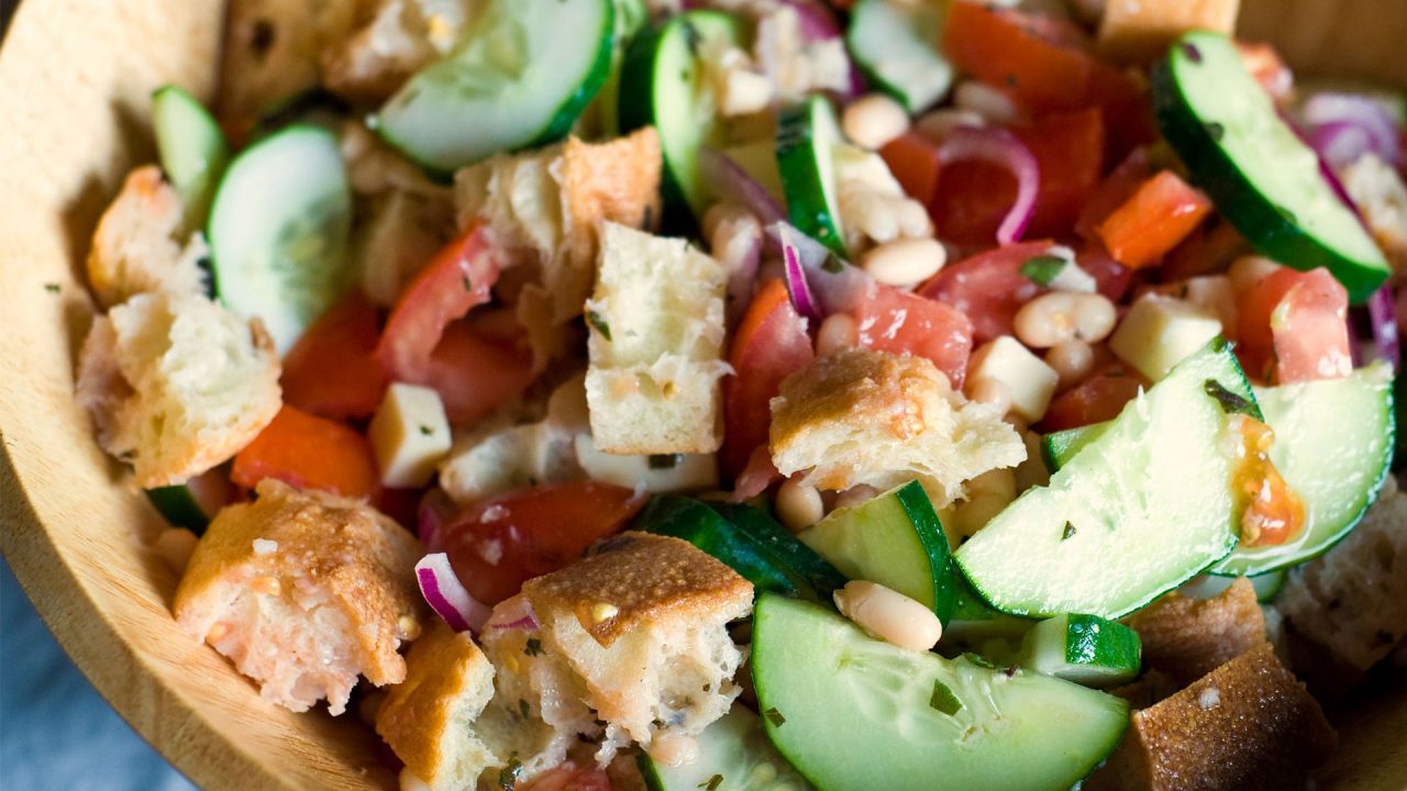 Panzanella with cucumber, tomatoes and bread in a bowl