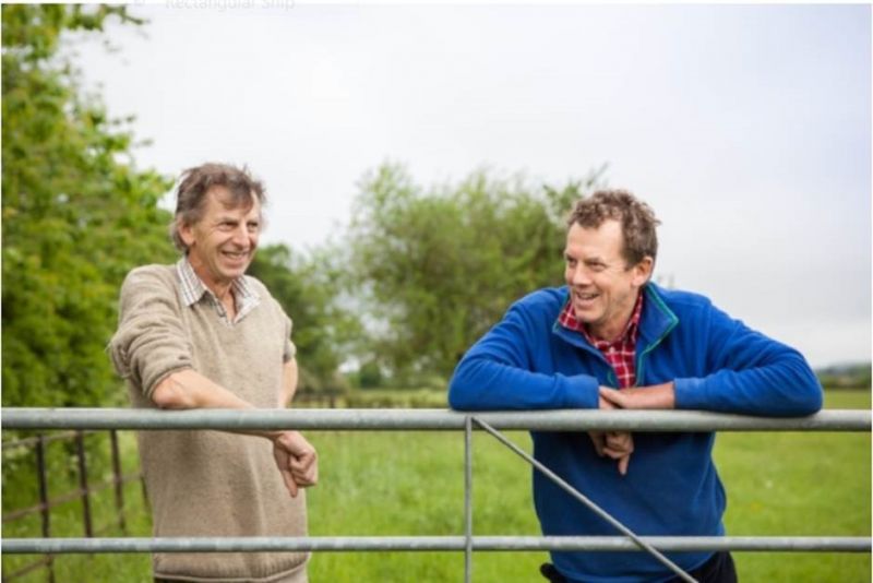 Farmers John & Paul Cherry at gate into field