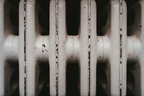 Close up image of a rusty space heater