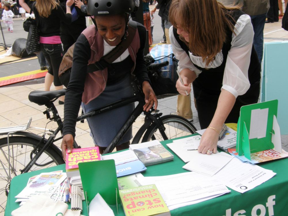 A woman visiting one of our local group stalls during the Big Ask campaign calling for a UK climate change law