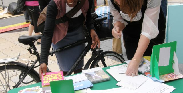 A woman visiting one of our local group stalls during the Big Ask campaign calling for a UK climate change law