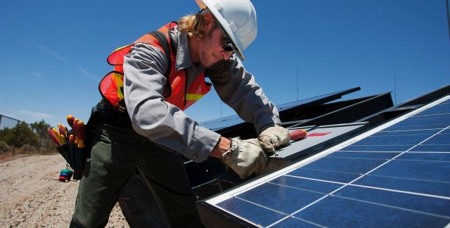 Man installing solar panel