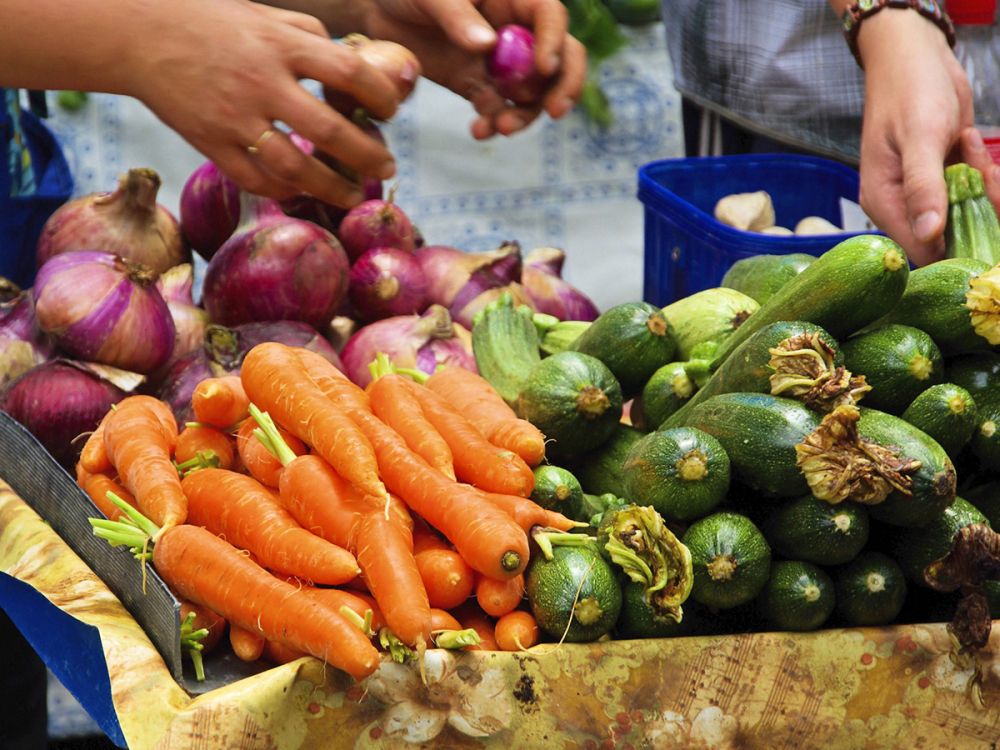 Carrots and courgettes in a fruit and vegetable market