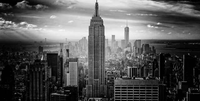 A black and white photo of New York city. The Empire State Building is prominent in the photo.