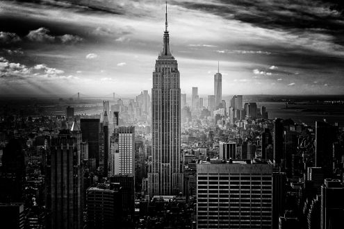 A black and white photo of New York city. The Empire State Building is prominent in the photo.