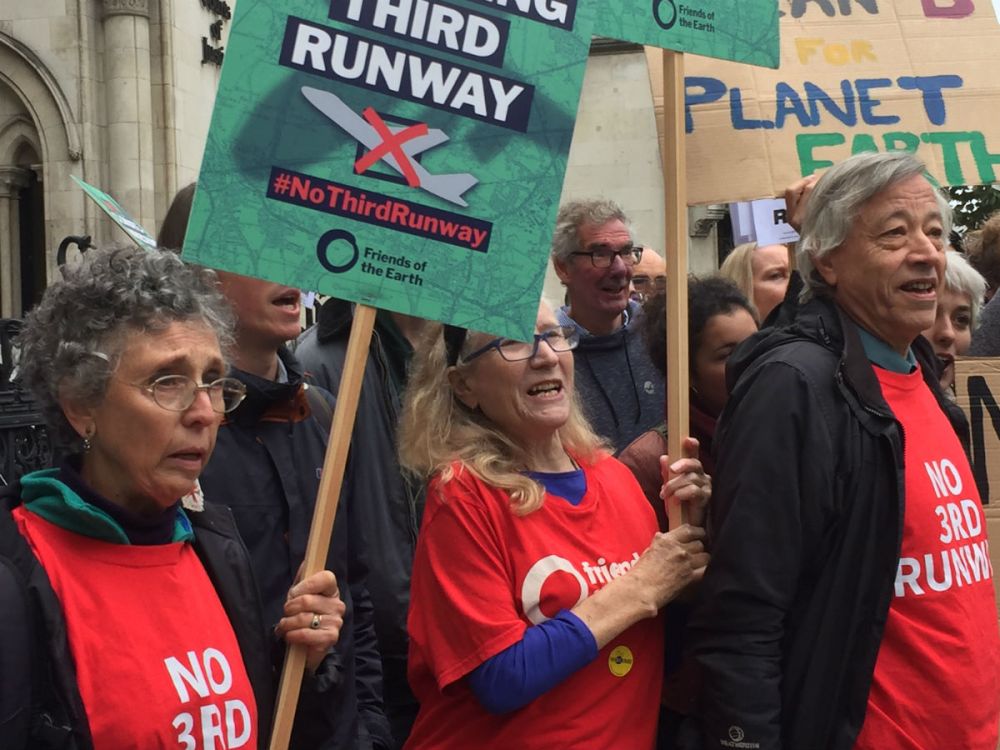 Close-up of Friends of the Earth supporters outside the High Court campaigning against a third Heathrow runway.