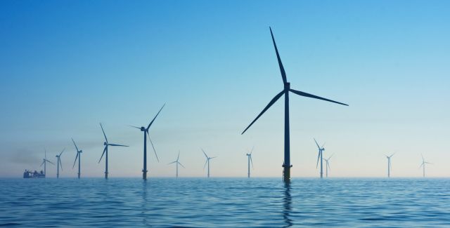 Several wind turbines in the ocean