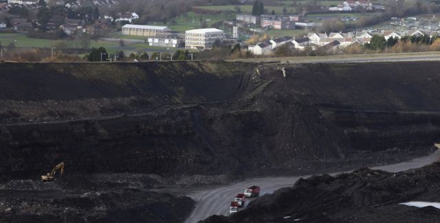 Quarry lorries move materials around the Ffos-Y-Fran opencast coal mine on November 17, 2009 in Merthyr Tydfil, Wales. 