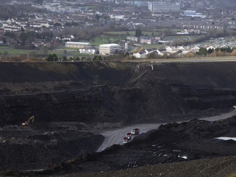 Quarry lorries move materials around the Ffos-Y-Fran opencast coal mine on November 17, 2009 in Merthyr Tydfil, Wales.