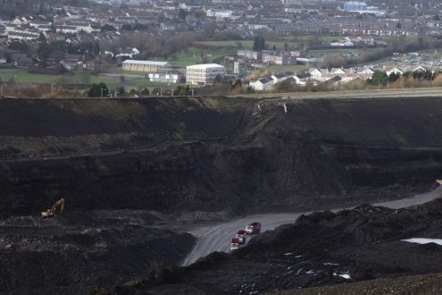 Quarry lorries move materials around the Ffos-Y-Fran opencast coal mine on November 17, 2009 in Merthyr Tydfil, Wales. 