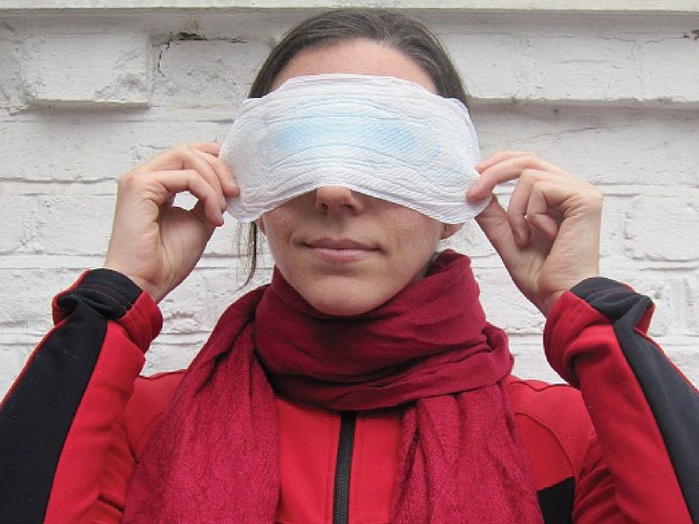 photo of woman holding sanitary pad