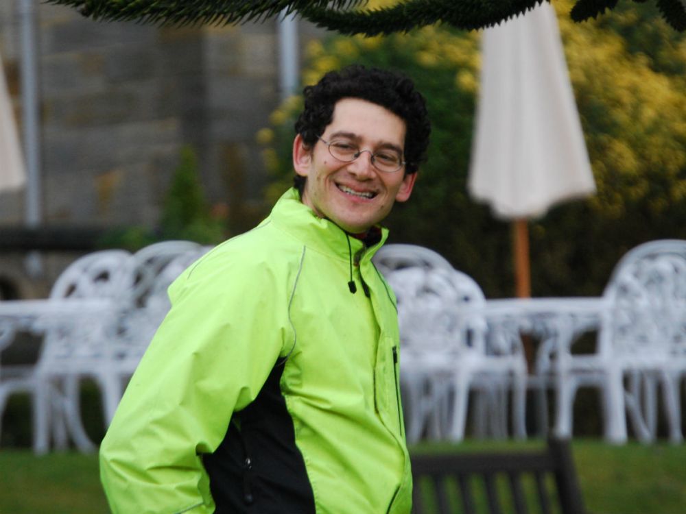 Phil Michaels smiling outdoors.