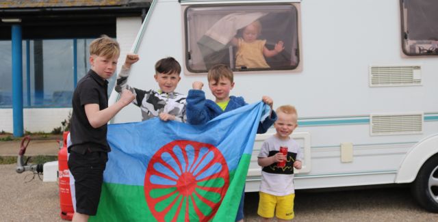 Children from a traveller community play in Hastings outside a caravan