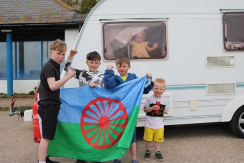 Children from a traveller community play in Hastings outside a caravan
