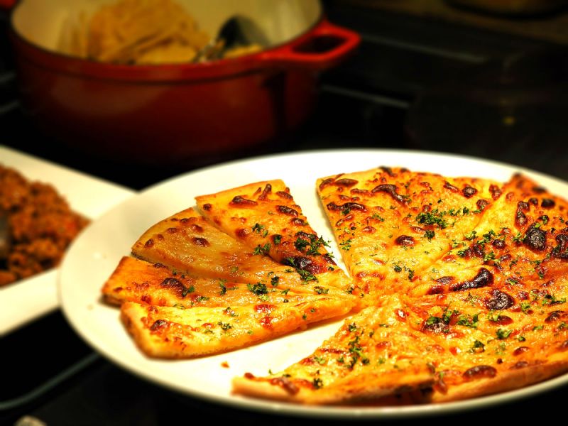 A pizza cut into slices