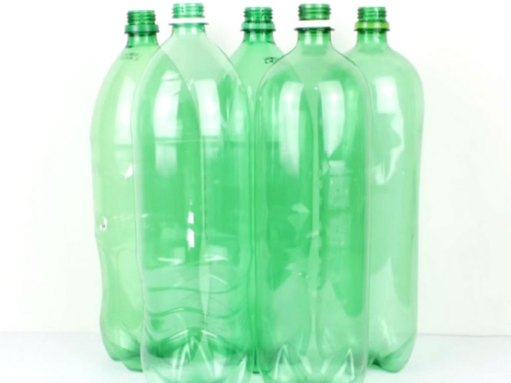 5 empty green plastic bottles