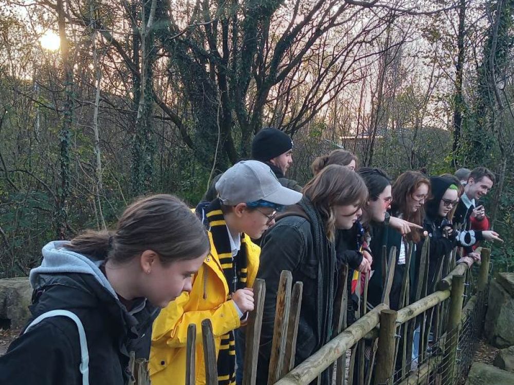 Student outside looking over a bridge.