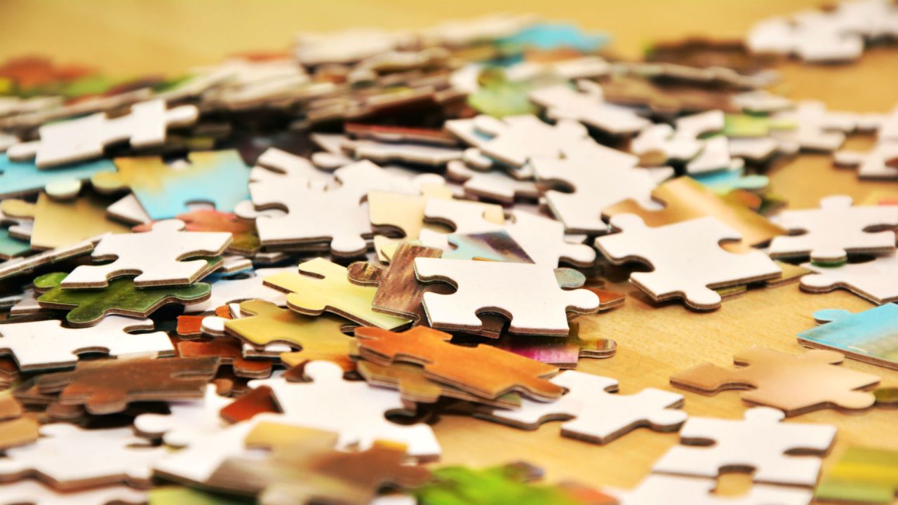 A jigsaw puzzle in pieces