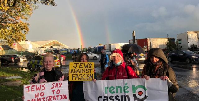 A group of protestors holding placards and banners 