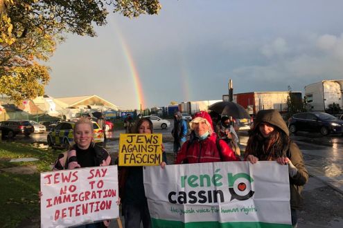 A group of protestors holding placards and banners 