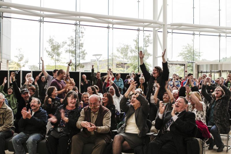 photo of people cheering