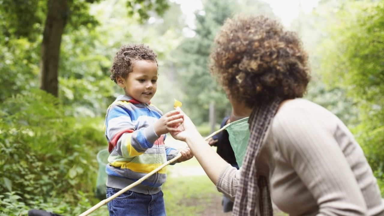 photo of woman and child exploring park