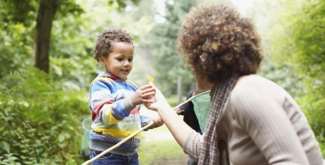 photo of woman and child exploring park