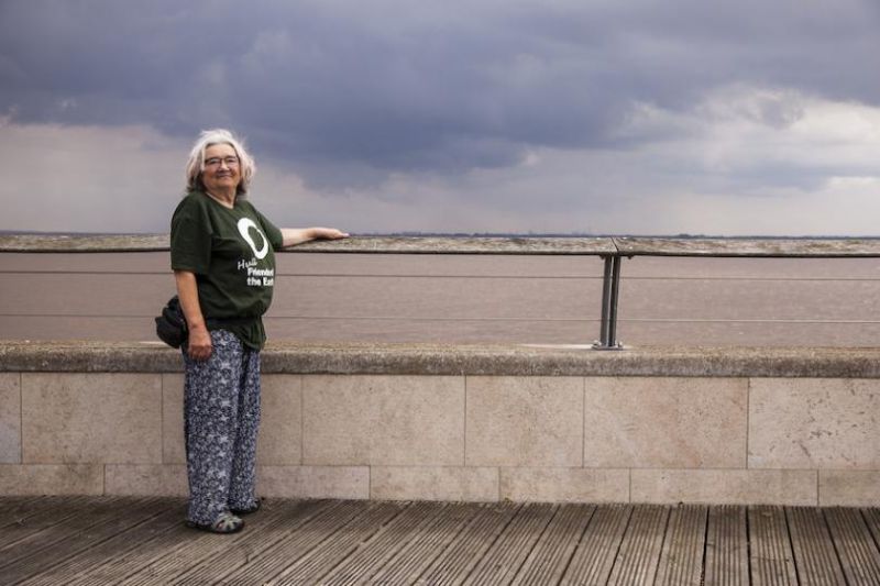 Angela Needham standing next to a river