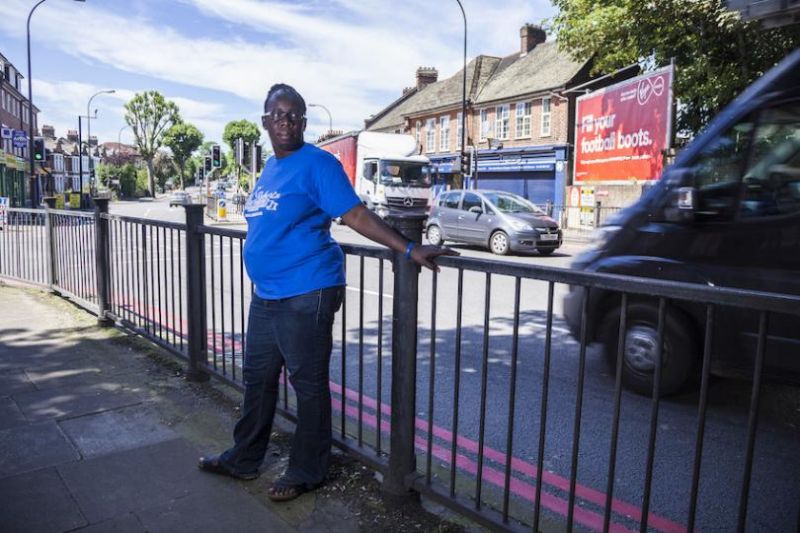 Rosamund Kissi Debrah by a road, facing camera.