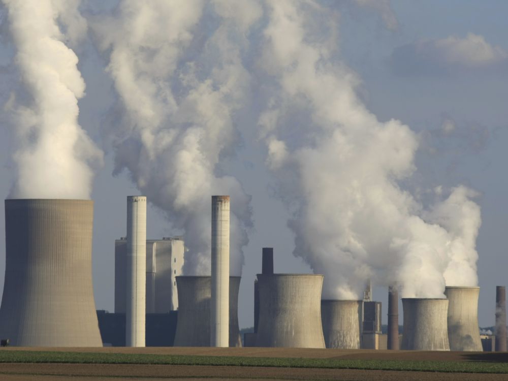 Cooling towers in action at a coal-fired power station