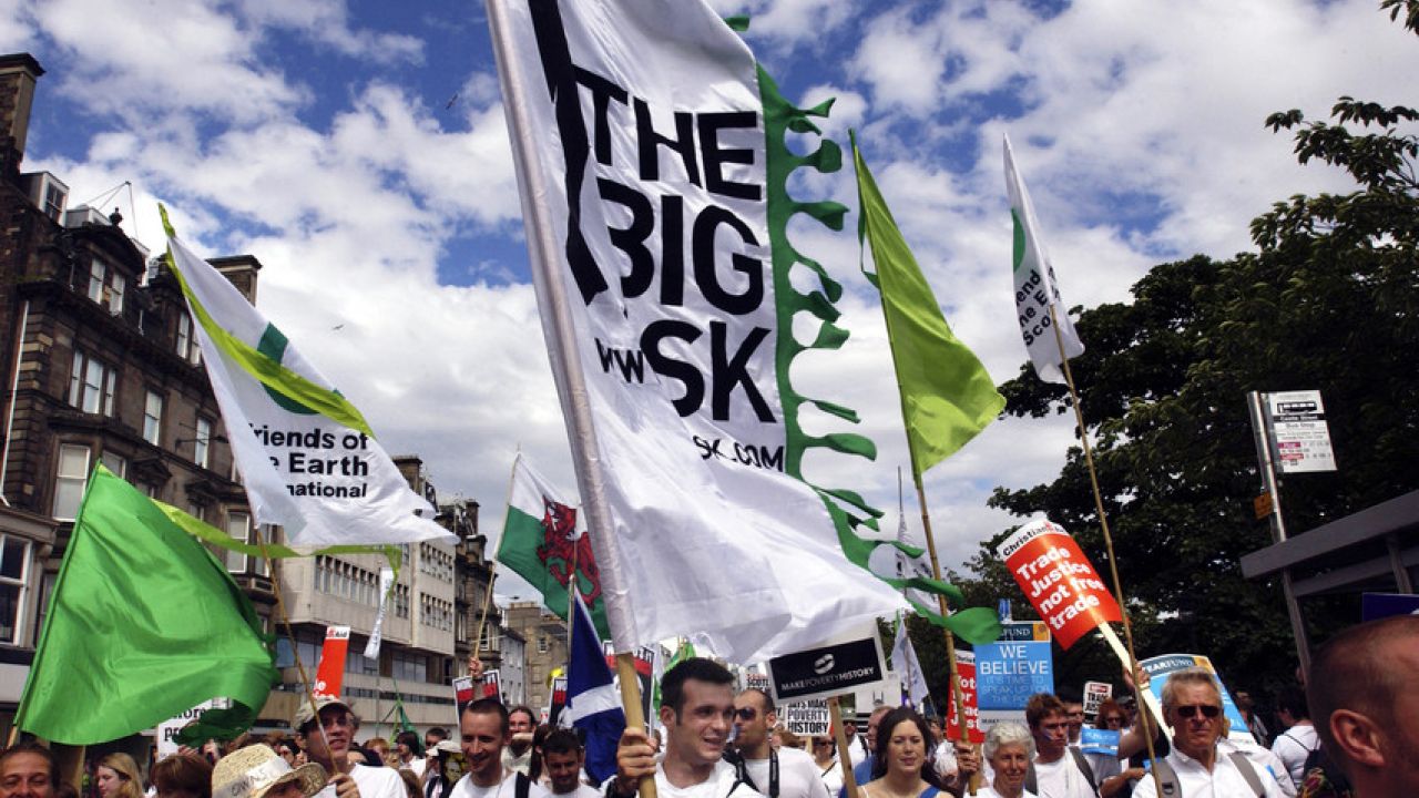 photo of peaceful march with Big Ask campaign banners