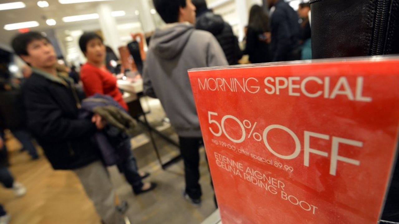 A 50%-off discount sign in a high street store