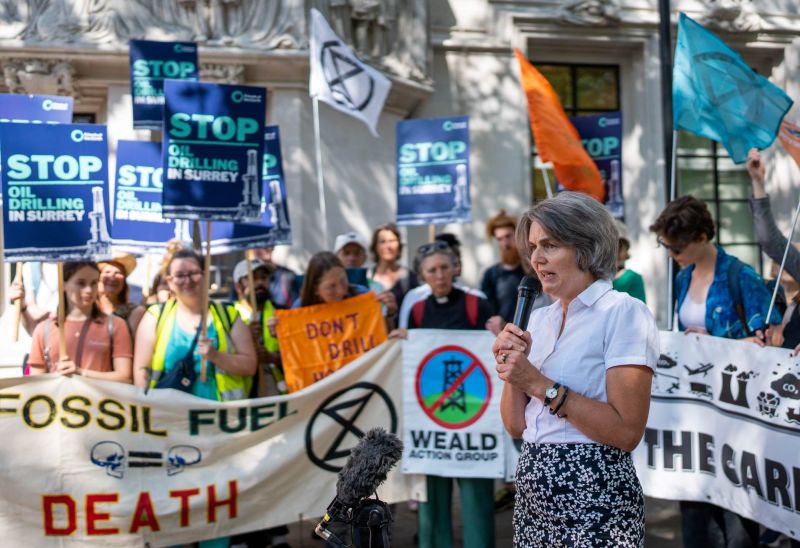 Sarah Finch speaking to a crowd outside the Supreme Court