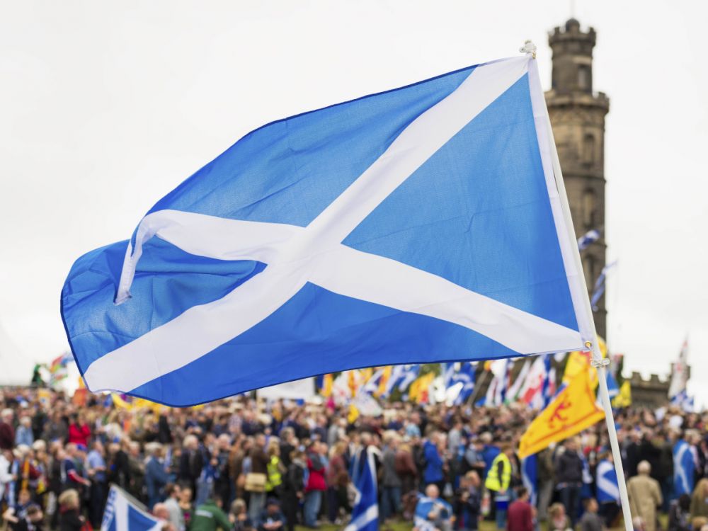 Campaigners holding Scottish flag on Edinburgh's Calton Hill