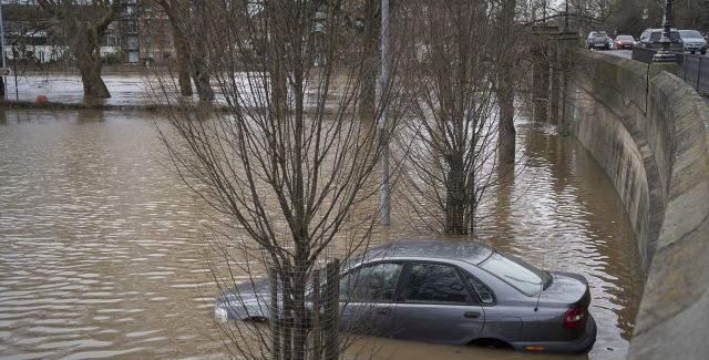 A car park with car submerged after flooding in York, 2020.