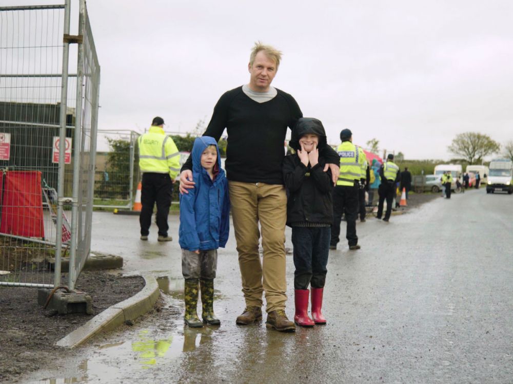 Steve Mason stands with his children at the fracking site in Ryedale