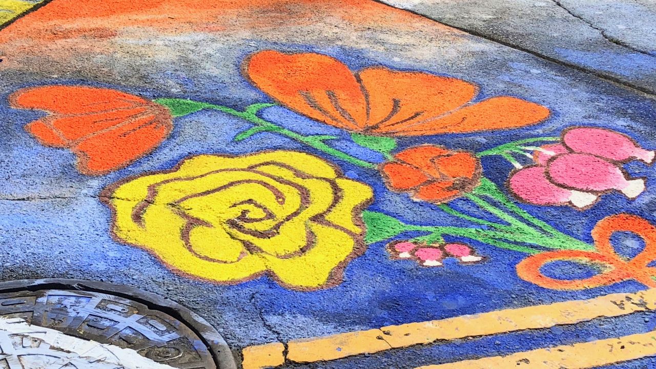 A painting of flowers sprayed on to the road from Climate Action March on Sep. 8, 2018, San Francisco