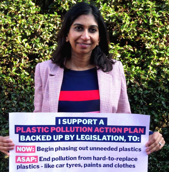 Suella Braverman, Conservative MP for Fareham, holding up a banner to declare support for a law to phase out non-essential plastics
