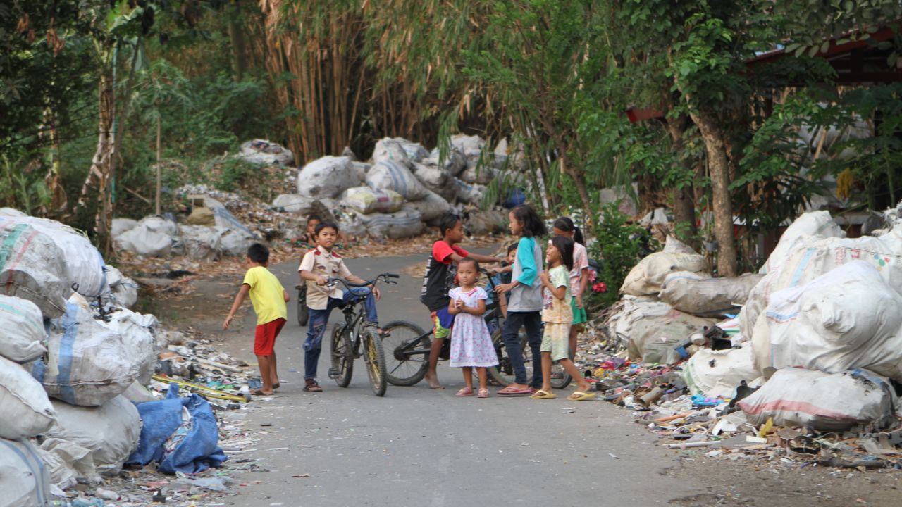 Piles of plastic waste outside a village in Surabaya