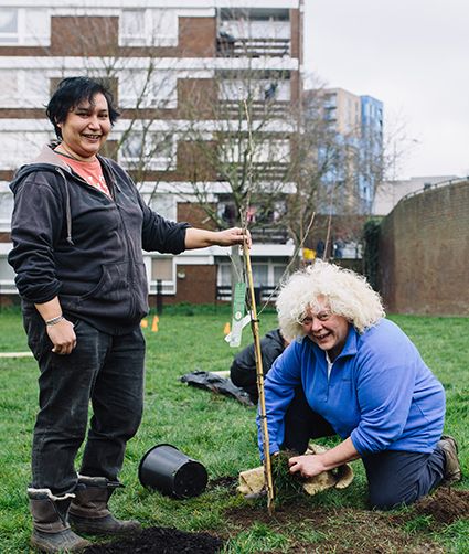 Members of the Urban Orchard Project getting their hands dirty
