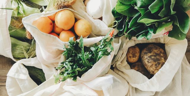 Zero waste solution: several tote bags containing groceries