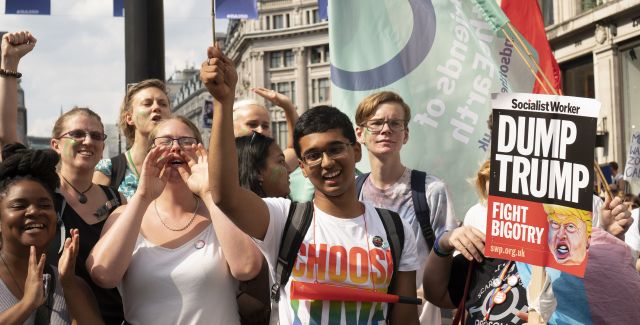 8 My World My Home students with banners and trainer attend the anti-Trump march in London July 2018