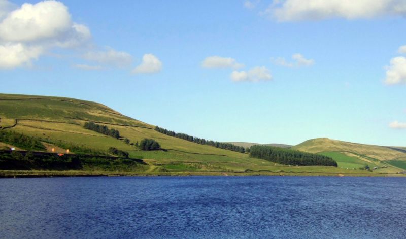 Woodhead Pass above reservoir in Peak District National Park with hills