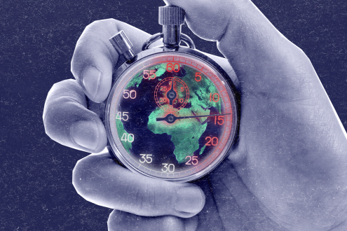 Hand holding a ticking clock