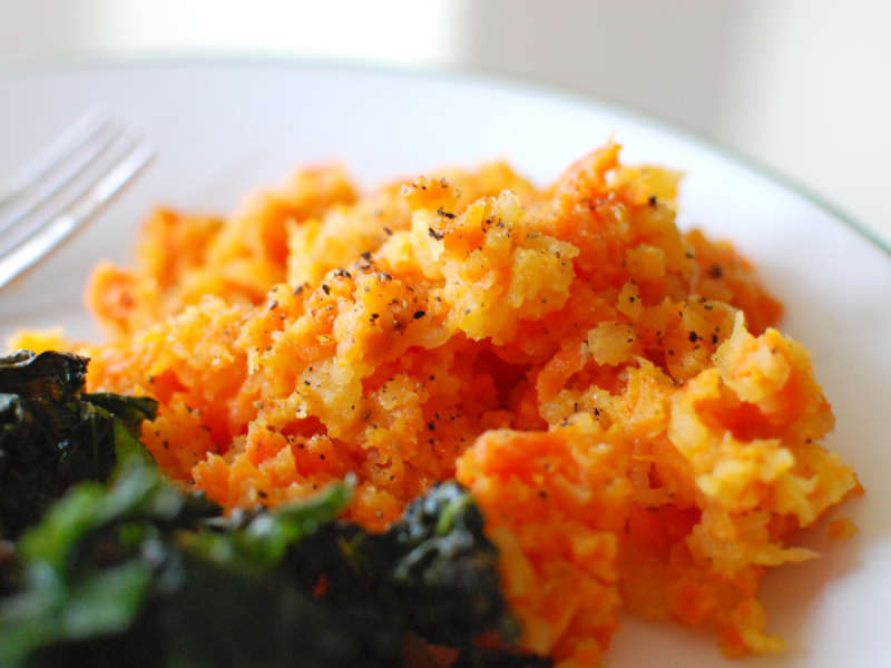 Plate of root vegetable mash and greens