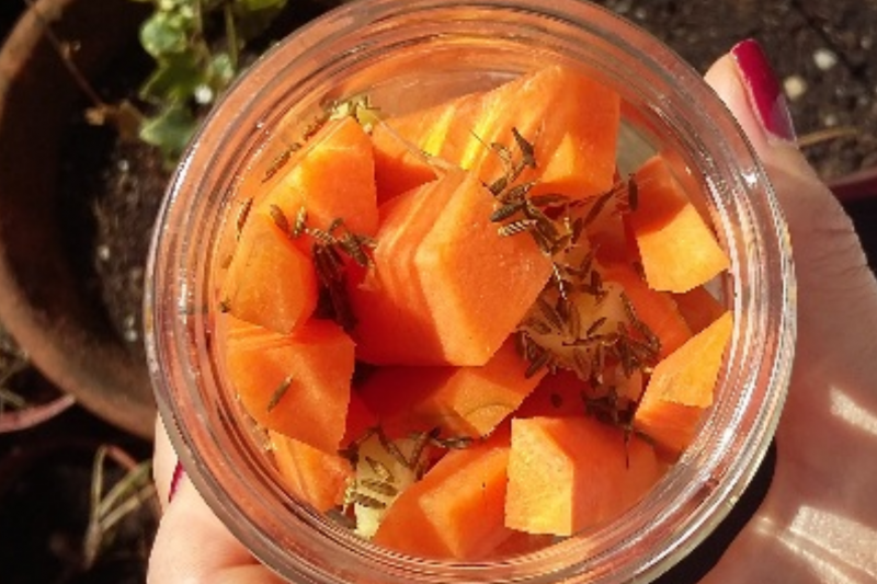 Easy fermented carrots and spices pictured in a jar