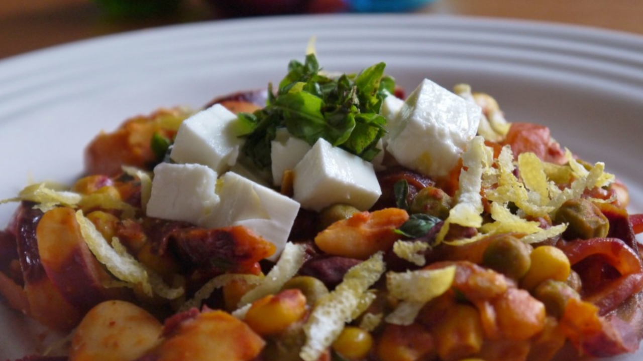 Harissa, kidney bean and chickpea one pot dinner with feta and fresh herbs