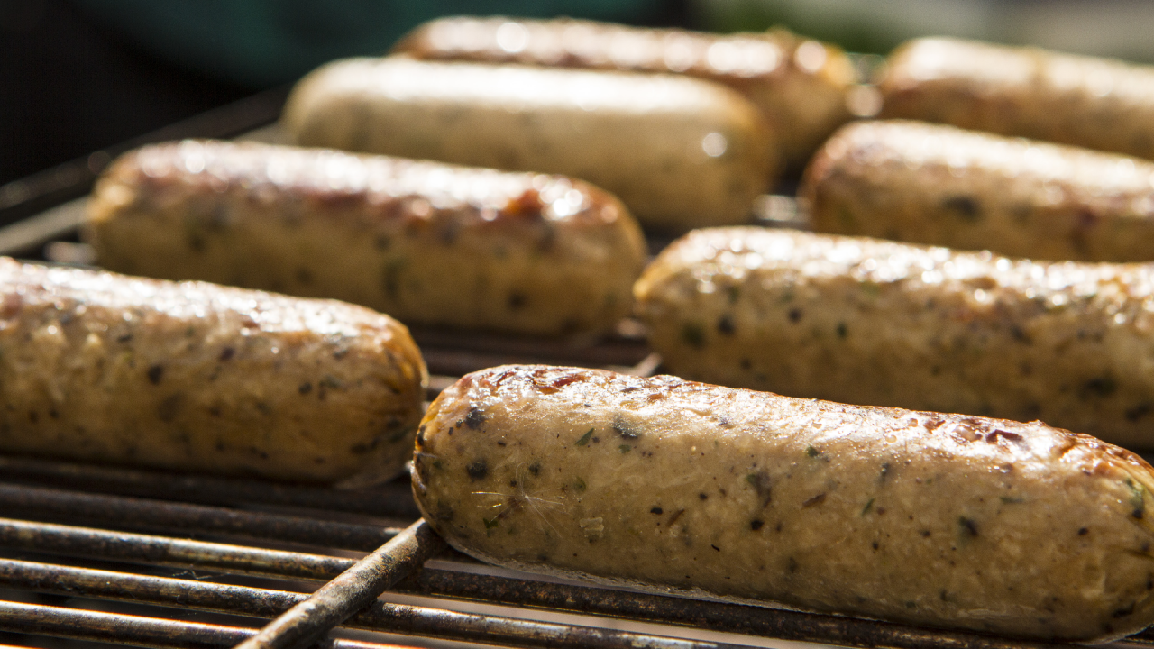 Meat-free sausages on a barbecue grill