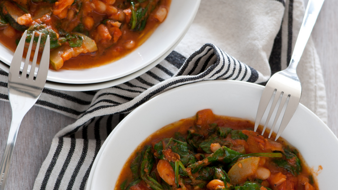 Vegetarian / vegan stew in two dinner bowls, ready to eat