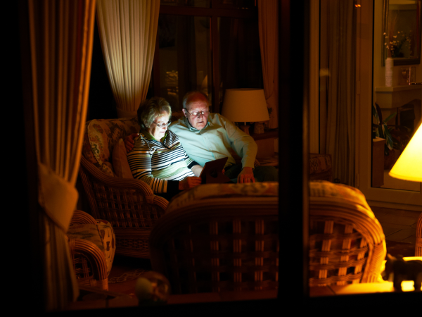 Elderly couple in dimly lit room